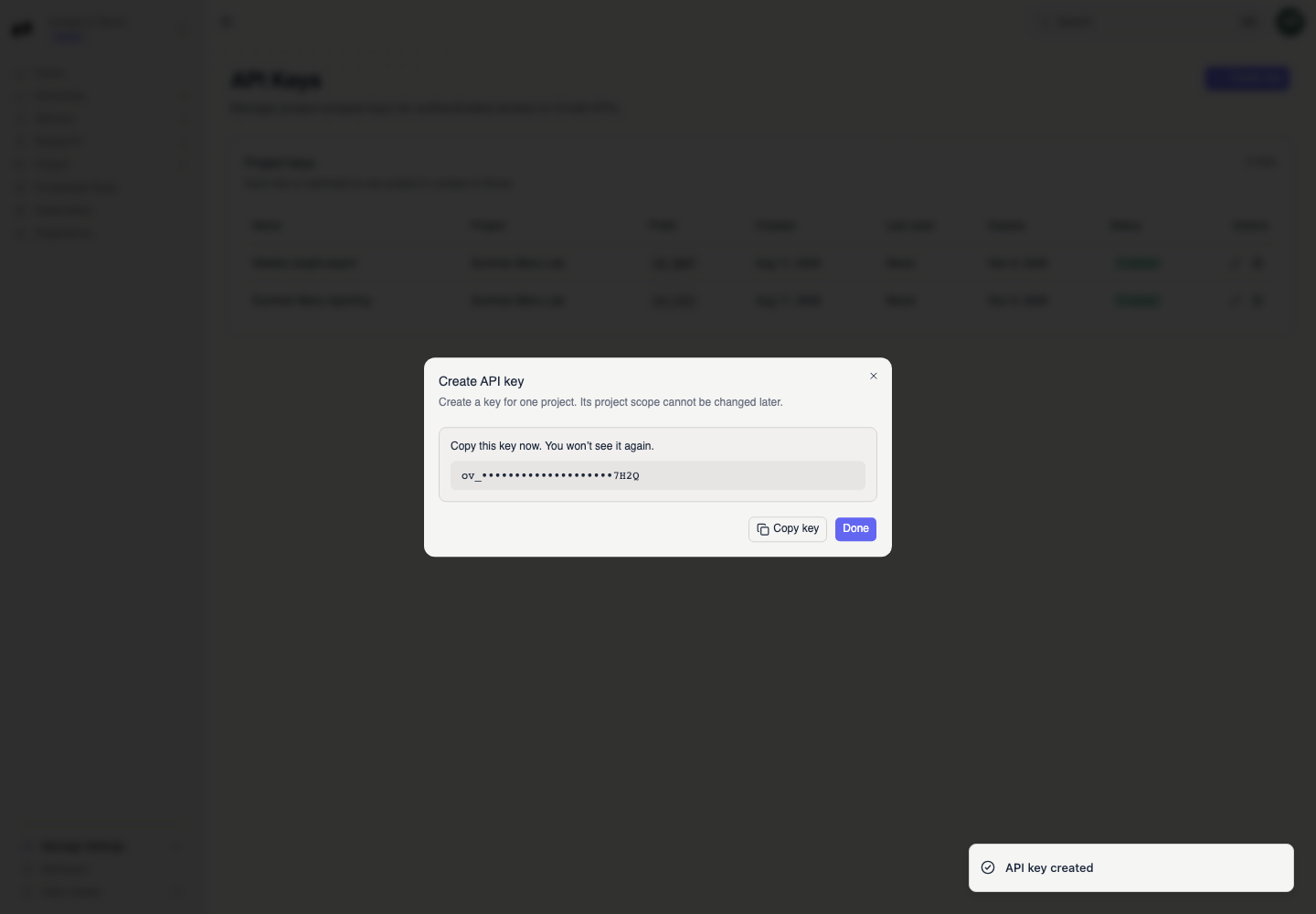 The successful Create API key dialog warns that the key appears once and provides Copy key and Done; the secret is redacted in the guide.